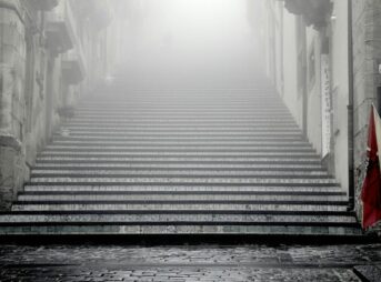 greyscale photography of concrete stairways